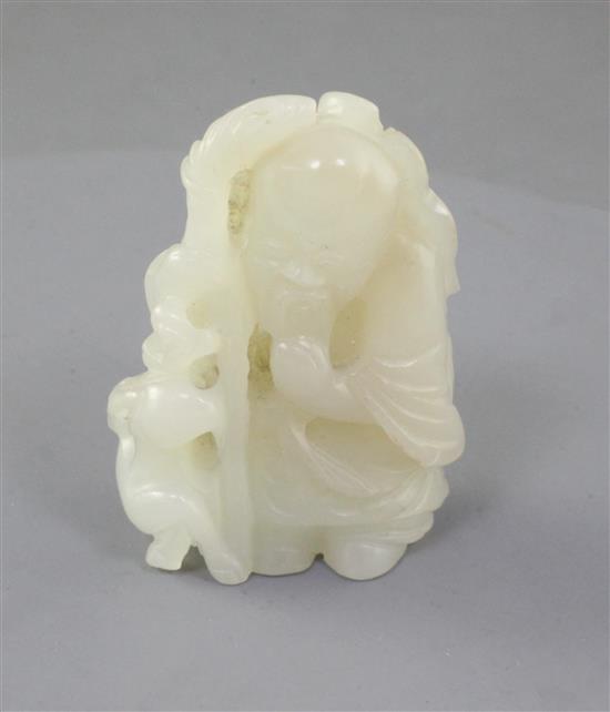 A Chinese pale celadon jade group of Shou Lao and a recumbent deer, 19th century, height 5.3cm